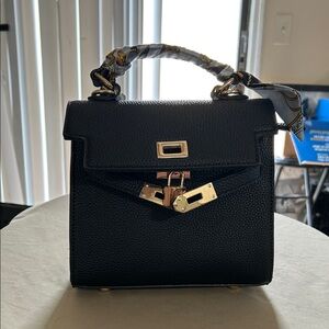 Elegant Black Mini Bag with Gold Hardware